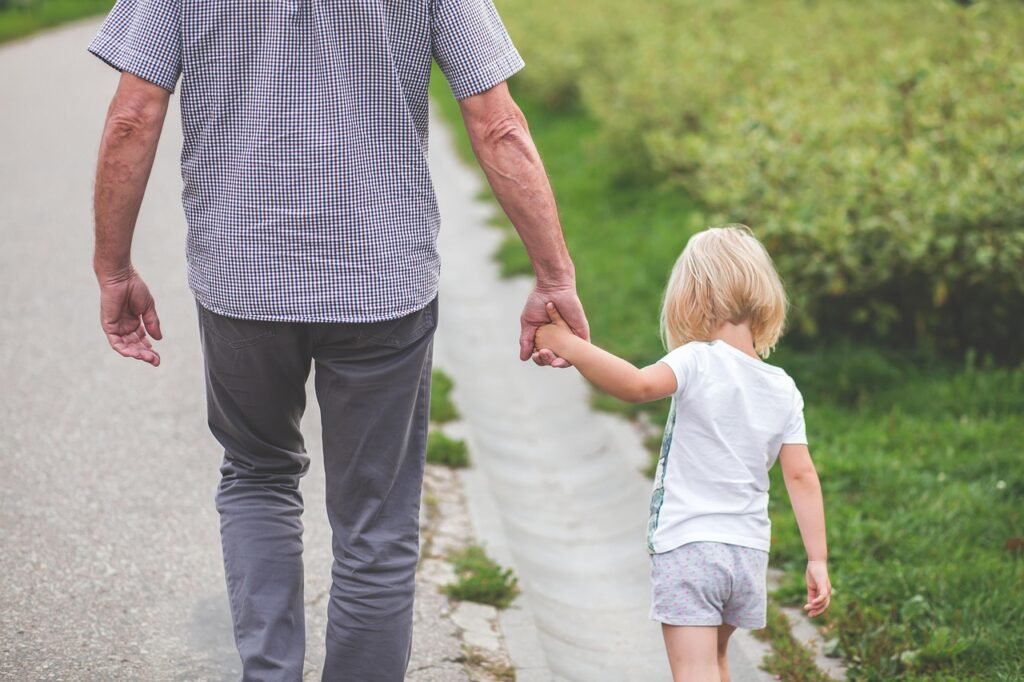 Confident parent holding hands with a smiling child, symbolizing success and connection