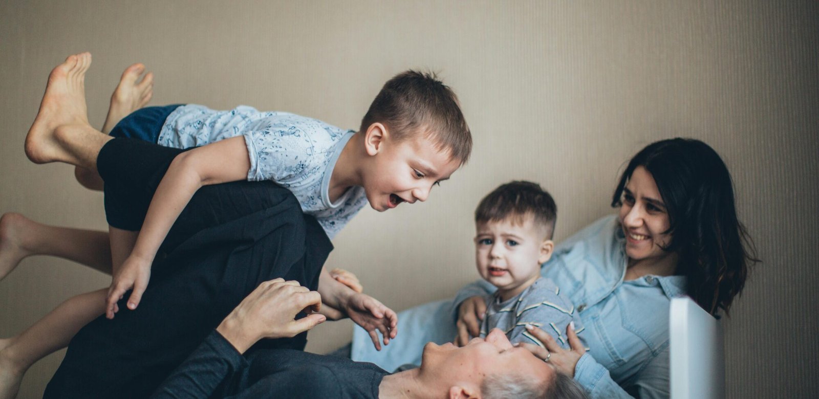 Father playing with his son in a happy family atmosphere