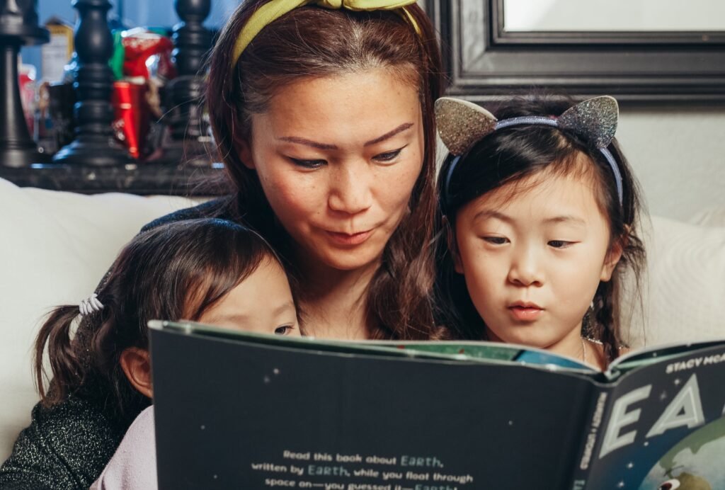 Mother gently hugging her toddler, showing calm and loving parenting approach with emotional connection and respect.
