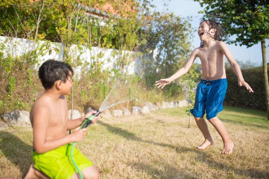 Happy child playing outside with friends showing emotional growth